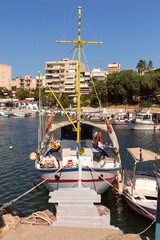 Fototapeta premium Traditional Fishing Boat in Chania Harbor, Crete, Greece