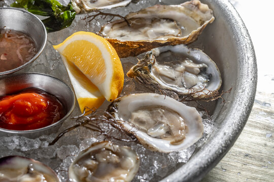close-up of oysters on the half shell with lemon