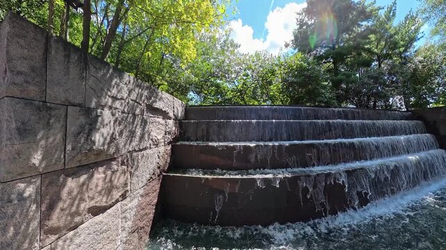 rising view leaves the pool and reveals the stepped FDR Memorial cascade.
