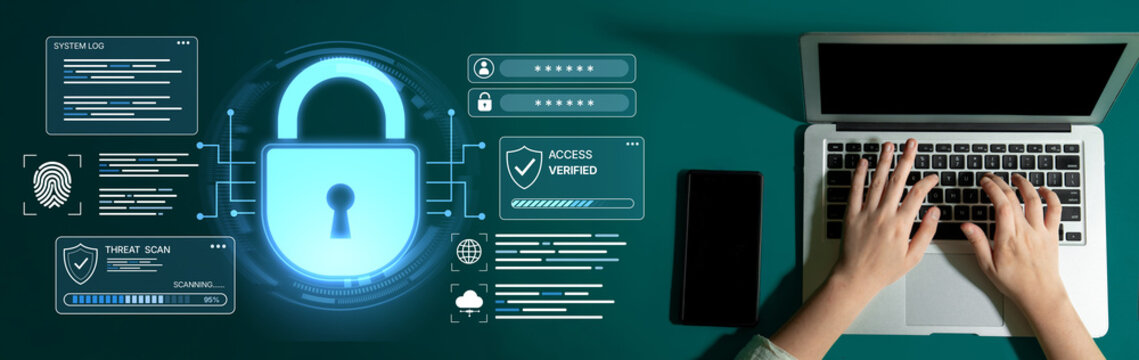 An overhead view of hands typing on a laptop, showing digital security elements like a lock icon and fingerprint technology, highlighting the importance of cybersecurity in work environments. Nascent