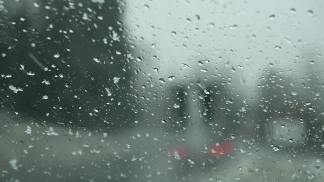 Bad weather, road traffic through a windscreen in heavy snowfall, Austria