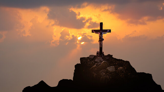 Jesus Christ Crucified on Cross at Golgotha Against Dramatic Sunset Sky 3D Render
