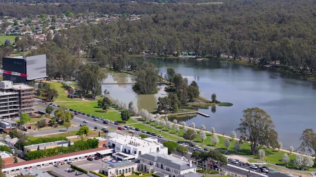 Aerial view of Shepparton lakeside road and blossom trees, Victoria