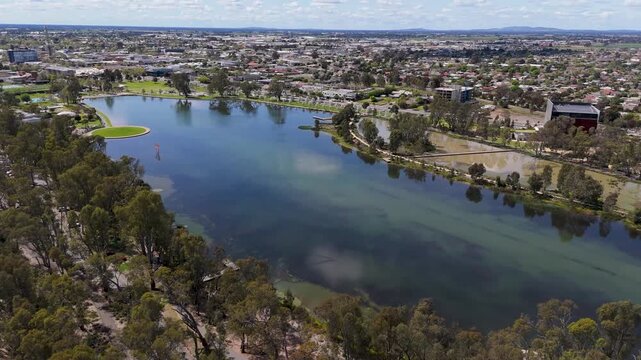 Scenic aerial of Victoria Park Lake wetlands and hills, Shepparton