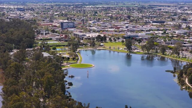Drone footage of Victoria Park Lake and Shepparton skyline, Victoria