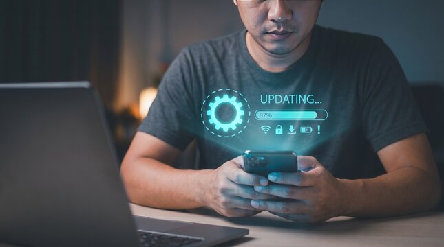 Man holding smartphone displaying software update progress bar graphic interface
