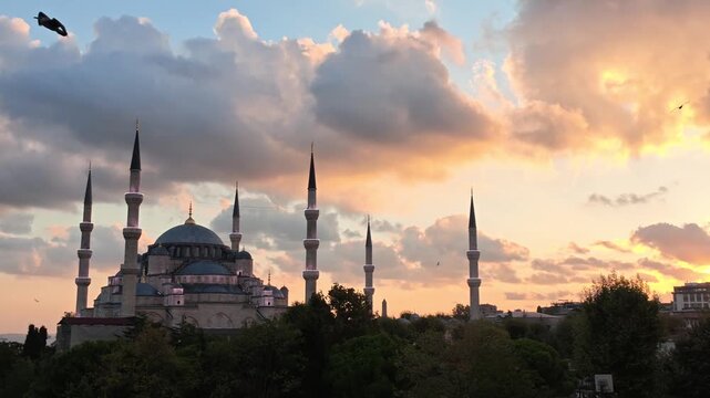 Istanbul's Blue Mosque silhouetted against a vibrant sunset sky