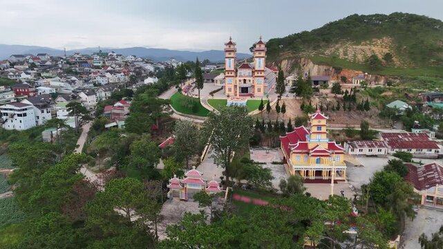 Aerial view of Cao Dai Temple of Da Lat on mountain hill, Dalat, Vietnam.