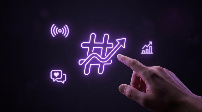 Social media growth concept with hand pointing at glowing hashtag and rising arrow representing viral trends and digital marketing success.