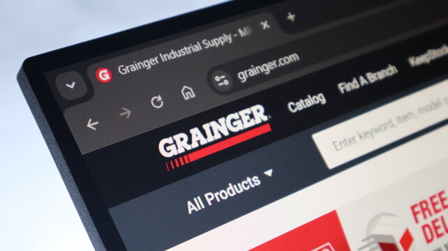 Grainger industrial supply website on computer monitor showing catalog and product search interface for industrial commerce.
