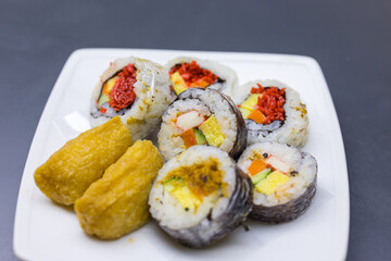 Assorted japanese sushi roll set served on white plate  © leungchopan