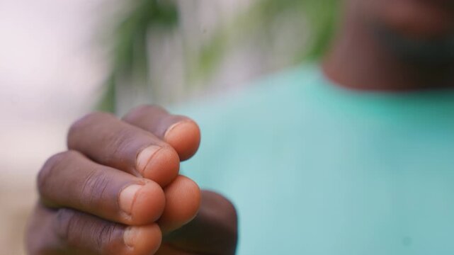 Close up view shows person hands performing different movements and positions. Background remains blurred keeping focus on detailed texture and motion of fingers throughout sequence