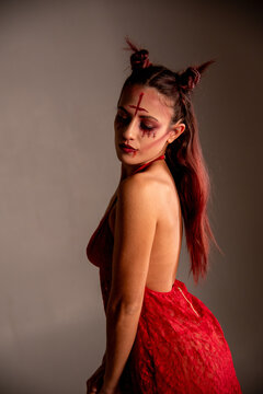Woman portraying devilish character with elaborate makeup
