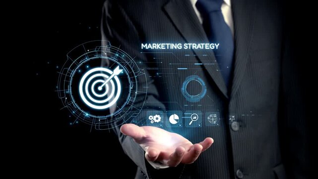 A businessman in a formal suit presents a visual concept of marketing strategy featuring a digital target and holographic graphics, emphasizing innovation in advertising. Qubit