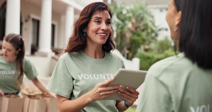 Volunteer, tablet and woman with hug for sign up outdoor, task delegation and happy or welcome. People, kindness and technology for community outreach, online checklist and charity or nonprofit team