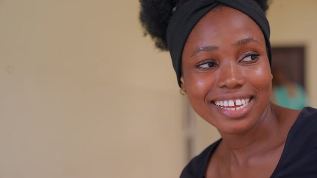 Close up view shows woman with visible skin texture and jewelry. subject expression changes subtly maintaining focus on their face and upper body closeup