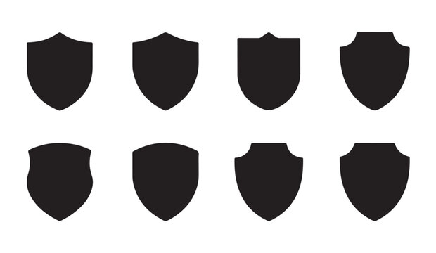 Set of eight black shield icons with flat shapes for security emblems and website user interface design elements.
