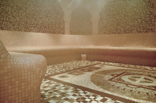 Turkish bath or steam sauna with mosaic tiles inside male locker room of spa or wellness are onboard luxury cruiseship or cruise ship liner