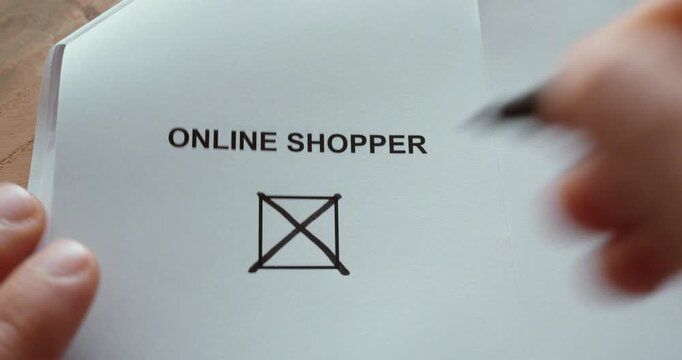 Close-up of a person marking an &ldquo;Online Shopper&rdquo; checkbox with a pen, representing ecommerce, digital shopping, consumer behavior and online purchasing.