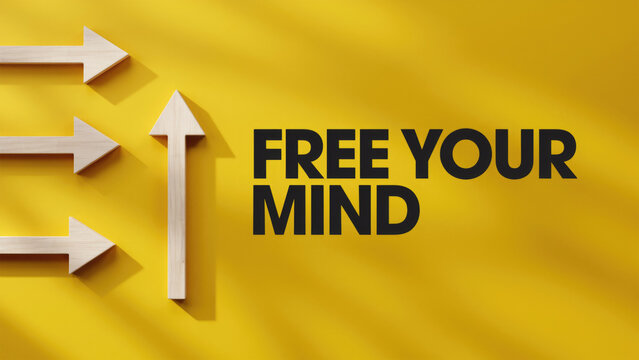 Wooden arrows pointing in different directions on a yellow background with text free your mind with directions next phrase bright yellow surface point different focus