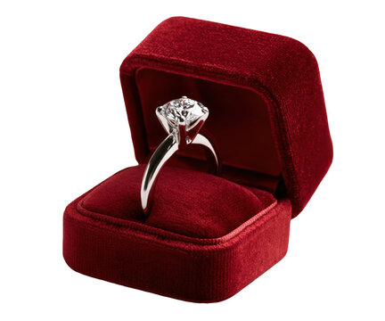 Elegant diamond engagement ring in a red velvet box isolated on transparent background