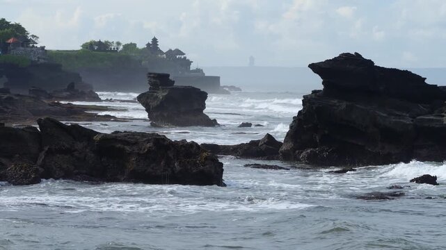 Majestic Sea Outcrop With Temple Silhouette, Powerful Swell And Crashing Surf, Layered Cliffs Receding Into Mist, Distant Balinese Shrine On Headland, Moody Clouds And Dramatic Light, Tanah Lot