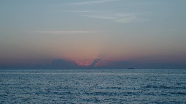 Sunrise with sea and beach. Calm horizon view at sea on sunrise. Romantic summer vacation view on seascape. Early morning. Sea sunrise on ocean beach. Sunset seascape at summer vacation