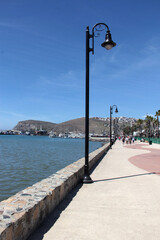 Fototapeta premium Ensenada, Baja California, Mexico - Mar 16, 2025: Pier, Monumental Flag Park and Civic Plaza of Ensenada, Baja California in Mexico is a cruise port