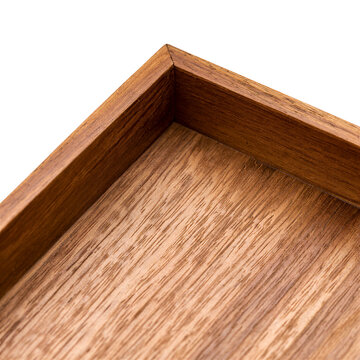 Teak tray mitred corner macro crop showing upstand and base panel joint on a transparent background