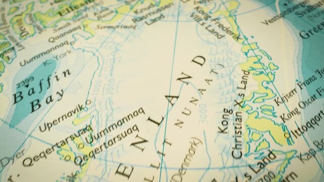 Gliding view over Greenland &ndash; smooth camera movement over a physical atlas map