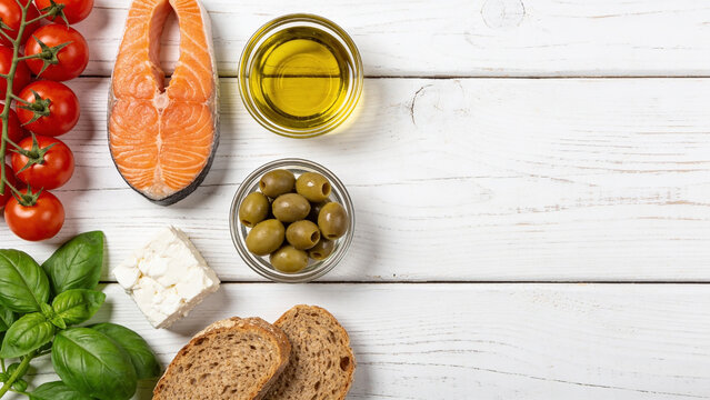 Mediterranean Diet Food with Olive Oil Salmon Feta and Fresh Vegetables Healthy Eating Copy Space