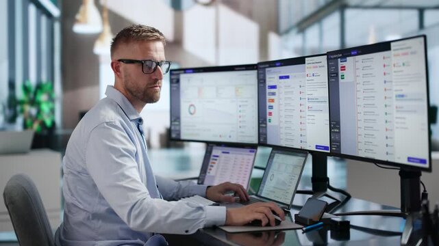 Regulatory Manager Reviews Compliance Audit Findings On Laptop
