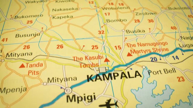 Smooth flyover toward Kampala, Uganda &ndash; close-up view of atlas map