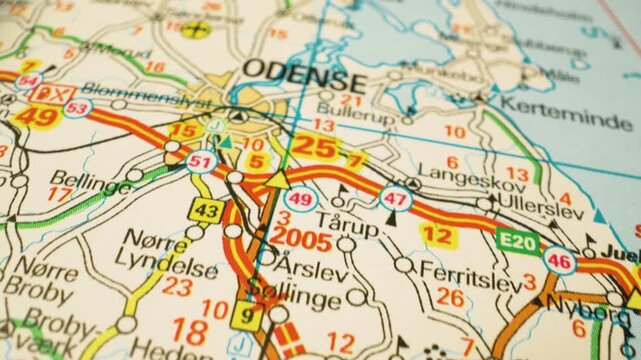 Road network leading to Odense, Denmark &ndash; gliding view over atlas map