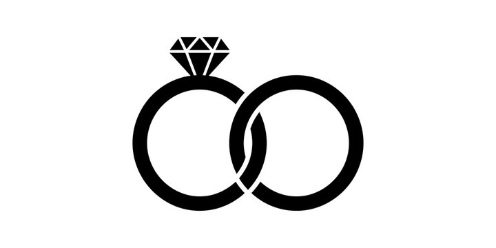 Two wedding rings intertwined with diamond for love and commitment symbol.