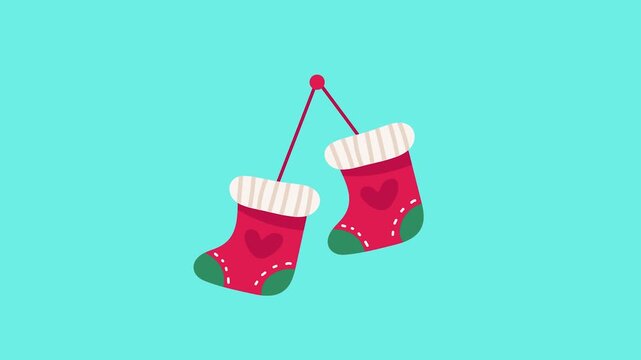 Delightful pair of festive red Christmas stockings, adorned with hearts and stripes, hanging for the holidays.