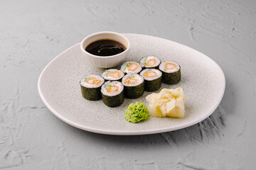 Shrimp maki sushi rolls with soy sauce and sides © AntAlexStudio