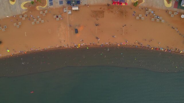 Aerial view of people relaxing on Bahia El Brete beach in Posadas, Argentina.