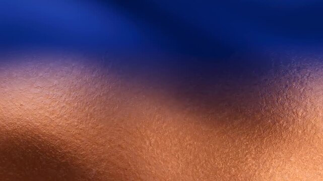 Copper surface showing a metallic texture and a blue gradient This material reflects light creating a shimmering visual.