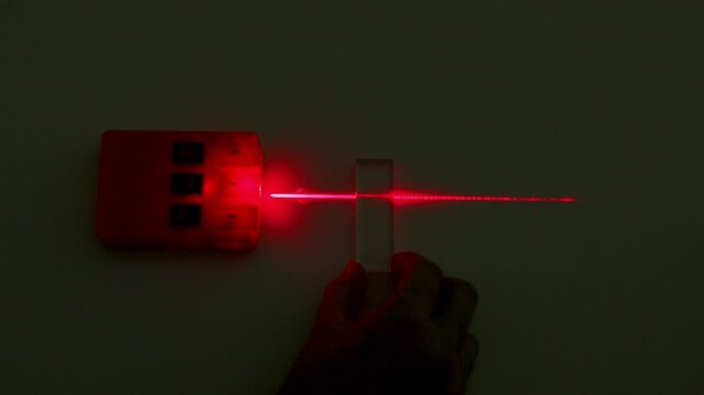 Red Laser Beam Refraction Physics Experiment with Glass Block