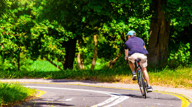 Cyclist ride on the bike path in the city Park
