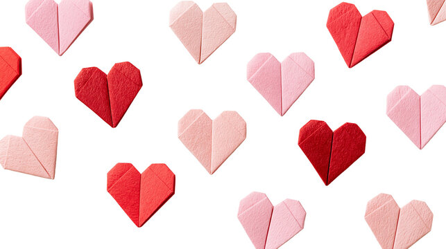 Red and pink paper origami hearts arranged in a scattered pattern