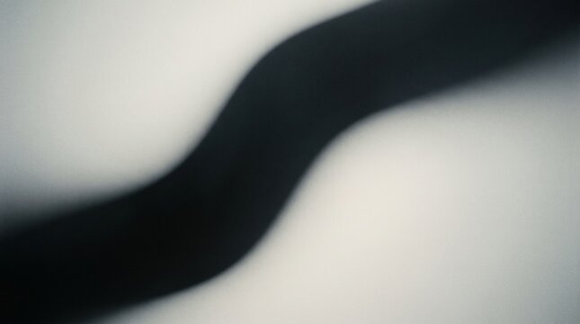 Ribbon shadow creates a sweeping s curve against a white background