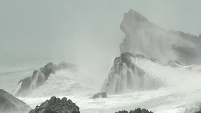 Storm Waves Crash Against Coastal Rocks During Hurricane