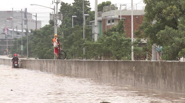 Flood Waters Hit City Flooding Highways