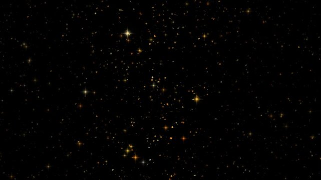 Dense gold glitter texture shimmering across a black background as tightly packed flakes and fine sparkles catch slow bands of light drifting over the surface