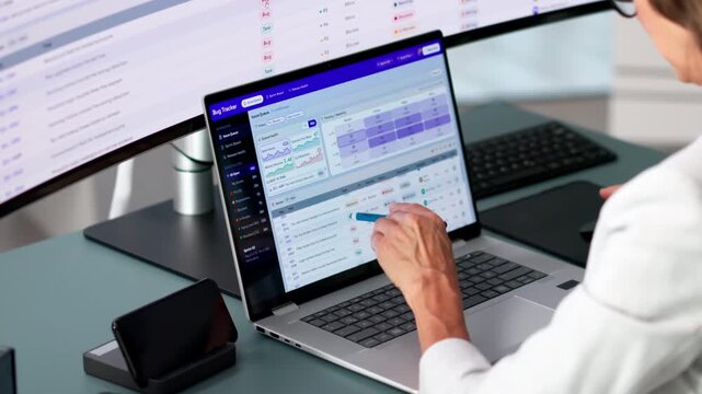 Software Developer Carefully Tracking Bug Reports