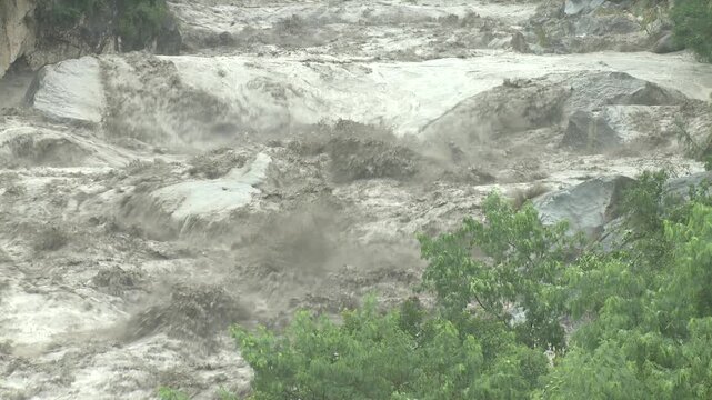 Swollen River Rages With Turbulent Flood Waters After Heavy Rain Tembin