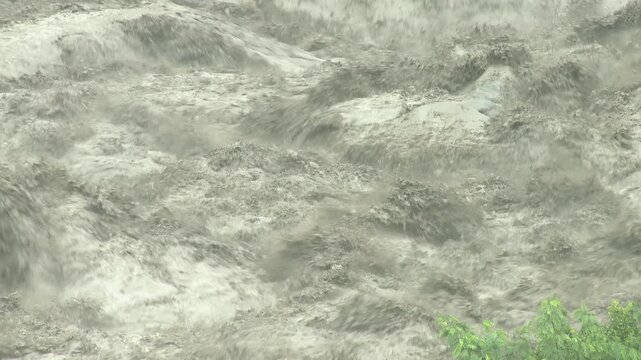 Violent Flood Waters Cascade Over Rocks As Hurricane Brings Heavy Rain Tembin