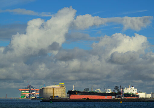 Oil tanker and LNG storage at Rotterdam harbour container terminal